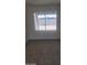 Minimalist bedroom with a large window and tiled floors at 4124 E Apollo Rd, Phoenix, AZ 85042
