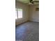Cozy bedroom with large window and tiled floors at 4124 E Apollo Rd, Phoenix, AZ 85042