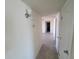 Hallway with wall sconce and tiled floor at 4124 E Apollo Rd, Phoenix, AZ 85042