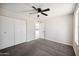 Bedroom featuring carpet, a ceiling fan, and a closet at 4737 E Belleview St, Phoenix, AZ 85008