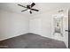 Bedroom featuring carpet, a ceiling fan, and a closet at 4737 E Belleview St, Phoenix, AZ 85008