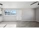 Bright living room featuring tile floors and a large window at 4737 E Belleview St, Phoenix, AZ 85008