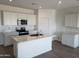 Bright kitchen featuring stainless appliances and a kitchen island at 48467 N Duran Way, Gold Canyon, AZ 85118