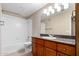 Bright bathroom featuring updated vanity with granite counters and a shower-tub combination at 5345 E Van Buren St # 308, Phoenix, AZ 85008