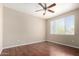 Bedroom with laminate floors and ceiling fan, offering ample space and natural light at 5345 E Van Buren St # 308, Phoenix, AZ 85008