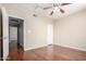 Bedroom with ceiling fan and laminate flooring, offering a comfortable and neutral space at 5345 E Van Buren St # 308, Phoenix, AZ 85008