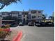 Apartment building exterior showcasing multiple levels, balconies, and carports for resident parking at 5345 E Van Buren St # 308, Phoenix, AZ 85008