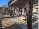 Community pool with lounge chairs, tables and chairs, and BBQ in an enclosed pergola at 5345 E Van Buren St # 308, Phoenix, AZ 85008