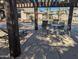 Relaxing pool area with multiple lounge chairs, tables and chairs, and a view of the apartments at 5345 E Van Buren St # 308, Phoenix, AZ 85008