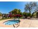 Community hot tub surrounded by beautiful landscaping and greenery at 5345 E Van Buren St # 308, Phoenix, AZ 85008