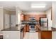 Well-equipped kitchen boasts stainless steel appliances, granite countertops, and tile flooring at 5345 E Van Buren St # 308, Phoenix, AZ 85008