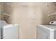 A compact laundry area equipped with a modern washing machine and dryer at 5345 E Van Buren St # 308, Phoenix, AZ 85008