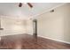 Open living room space features wood floors, a chandelier, and neutral wall paint at 5345 E Van Buren St # 308, Phoenix, AZ 85008