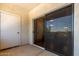 Covered patio with sliding glass door, closet and balcony at 5345 E Van Buren St # 308, Phoenix, AZ 85008