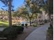 Community pond view with water feature, beautiful landscaping, and apartments in the background at 5345 E Van Buren St # 308, Phoenix, AZ 85008
