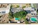 Aerial view of a home with two swimming pools and solar panels at 5809 W Morten Ave, Glendale, AZ 85301