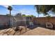 Backyard animal pen structure surrounded by foliage and shade at 5809 W Morten Ave, Glendale, AZ 85301