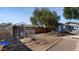 Large backyard with mature trees and an enclosed animal pen at 5809 W Morten Ave, Glendale, AZ 85301