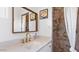 Chic bathroom featuring a quartz countertop, tiled shower, and modern fixtures at 5809 W Morten Ave, Glendale, AZ 85301