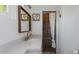 Stylish bathroom with quartz countertop, gold faucet, and tiled shower at 5809 W Morten Ave, Glendale, AZ 85301