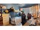Functional bedroom with bunk beds, work space, neutral carpet, and natural light at 5809 W Morten Ave, Glendale, AZ 85301
