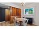 Cozy dining room with modern chandelier and natural lighting at 5809 W Morten Ave, Glendale, AZ 85301