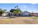 Charming single-story home with mature landscaping and a spacious front yard at 5809 W Morten Ave, Glendale, AZ 85301