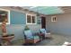 Inviting front patio with stylish seating, water fountain, and neutral tones at 5809 W Morten Ave, Glendale, AZ 85301