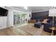 Stylish living room with a sliding glass doors, hardwood floors, modern decor, and lots of natural light at 5809 W Morten Ave, Glendale, AZ 85301