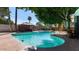 Inviting backyard with a private pool, mature trees, gazebo, and outdoor seating at 5809 W Morten Ave, Glendale, AZ 85301