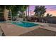Backyard swimming pool with diving board, slide, adjacent gazebo, and ample patio space for entertaining at 5809 W Morten Ave, Glendale, AZ 85301