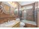 Updated bathroom features dual vanity mirrors, granite countertop, and a modern glass-enclosed shower at 607 W Palo Verde St, Gilbert, AZ 85233