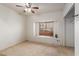 Relaxing bedroom featuring a window seat and ceiling fan, offering comfort and natural light at 607 W Palo Verde St, Gilbert, AZ 85233