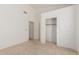 A well-lit bedroom featuring a neutral color palette and a spacious closet for ample storage at 607 W Palo Verde St, Gilbert, AZ 85233