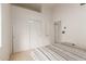 A bright bedroom showcasing a neat bed, large closet space, and access to an adjacent room at 607 W Palo Verde St, Gilbert, AZ 85233