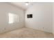 Bright bedroom with ceiling fan and a window offering natural light at 607 W Palo Verde St, Gilbert, AZ 85233