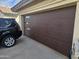 Stylish garage door featuring a sleek design, accent windows, and contemporary curb appeal at 607 W Palo Verde St, Gilbert, AZ 85233