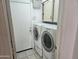 Practical laundry room with washer, dryer, and storage cabinets for convenience and organization at 607 W Palo Verde St, Gilbert, AZ 85233