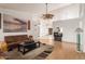 Expansive living area featuring high ceilings, wood floors, neutral decor, and an entertainment center at 607 W Palo Verde St, Gilbert, AZ 85233
