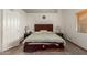 Main bedroom with a cozy bed, bedside tables, and laminate floors, offering comfort and style at 607 W Palo Verde St, Gilbert, AZ 85233