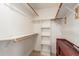 Well-organized walk-in closet with shelves and rods for ample storage space at 607 W Palo Verde St, Gilbert, AZ 85233
