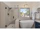 Bathroom with a walk-in shower and separate free standing soaking tub at 7079 S Kachina Dr, Tempe, AZ 85283