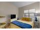 Bright bedroom with stylish decor, comfortable bed, and ample natural light from a large window at 7079 S Kachina Dr, Tempe, AZ 85283