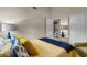 Bright bedroom with stylish decor, comfortable bed, and access to ensuite bathroom and closets at 7079 S Kachina Dr, Tempe, AZ 85283