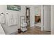 Hallway with wood floors, a closet and storage for towels at 7079 S Kachina Dr, Tempe, AZ 85283