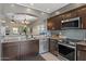 Bright kitchen features granite countertops and stainless steel appliances at 7079 S Kachina Dr, Tempe, AZ 85283