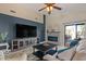 Cozy living room with stylish decor, and a modern entertainment center with a fireplace at 7079 S Kachina Dr, Tempe, AZ 85283