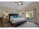 Main bedroom features a ceiling fan, sliding glass door and patio access at 7079 S Kachina Dr, Tempe, AZ 85283