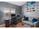 Comfortable home office features a desk area, seating, and shelving for decor and personal items at 7079 S Kachina Dr, Tempe, AZ 85283