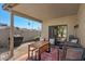Outdoor patio area with a dining table, seating, grill, and covered for shade and comfort at 7079 S Kachina Dr, Tempe, AZ 85283
